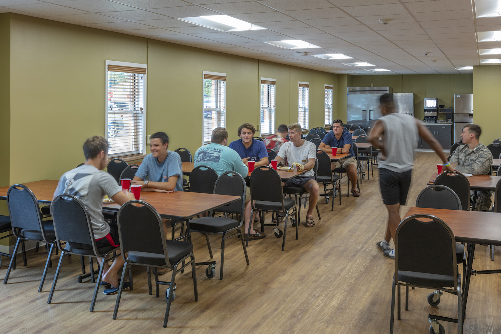 PIKE fraternity enjoying the dining room at Kansas State