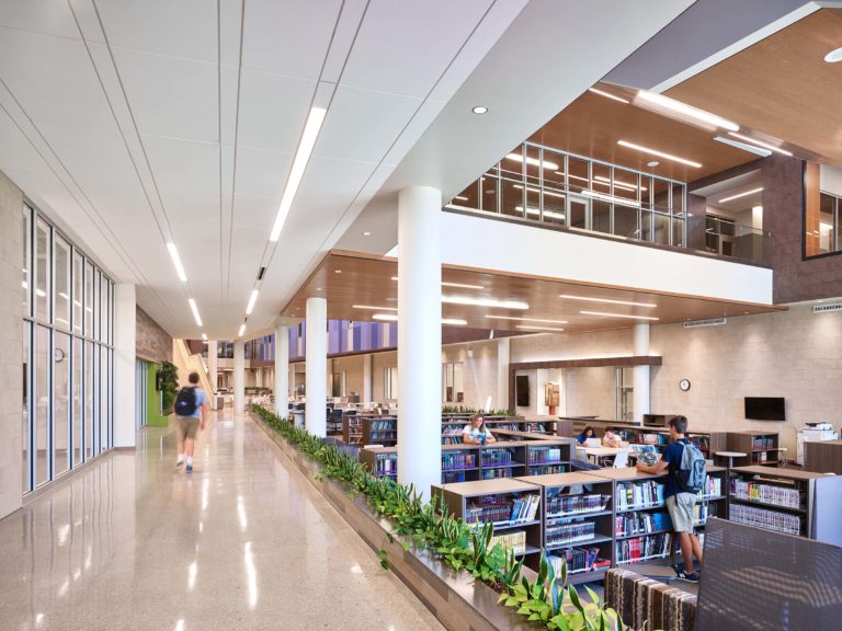 Interior of a brightly lit and new school library by McCownGordon Construction