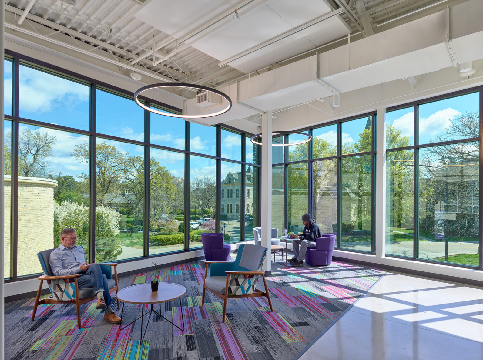 A seating area with large windows in the KSU Multicultural Student Center