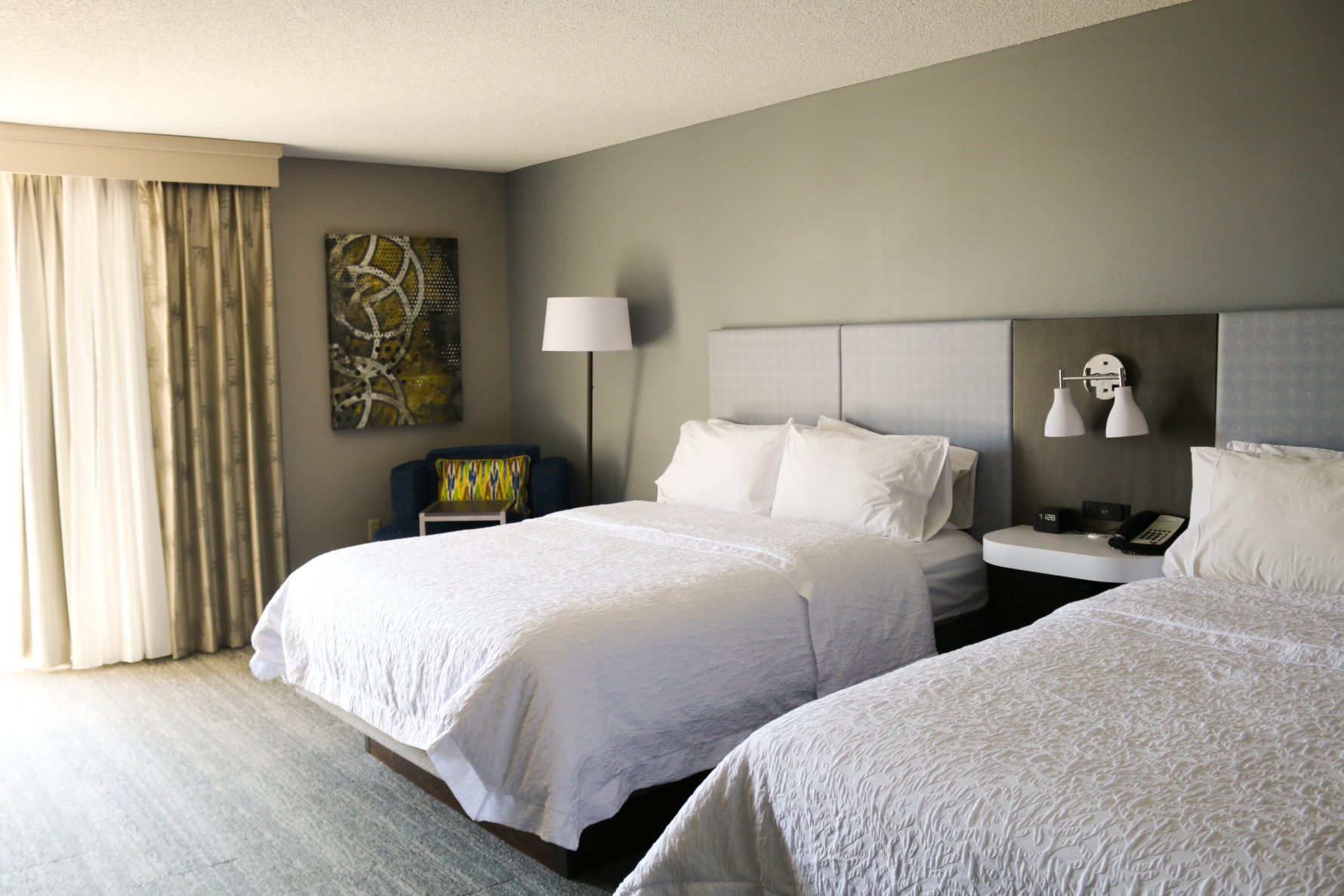 A photo of two beds in a room at Hampton Inn KC, renovated by McCownGordon Construction