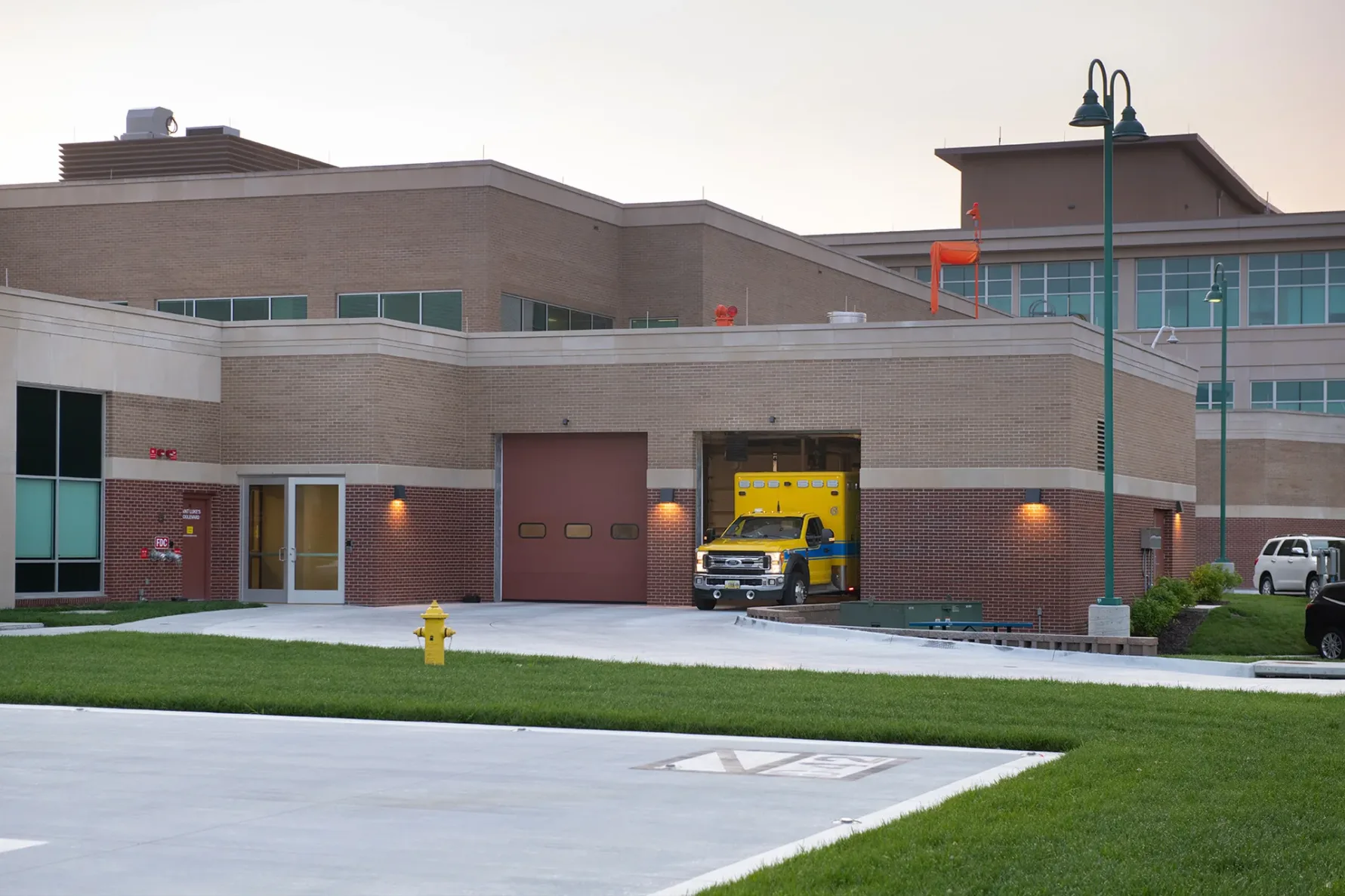 Ambulance pulling out of Saint Luke's East Flex Capacity