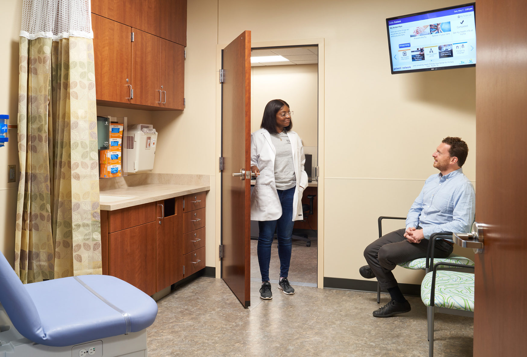 Truman Medical Center University II room with doctor and patient