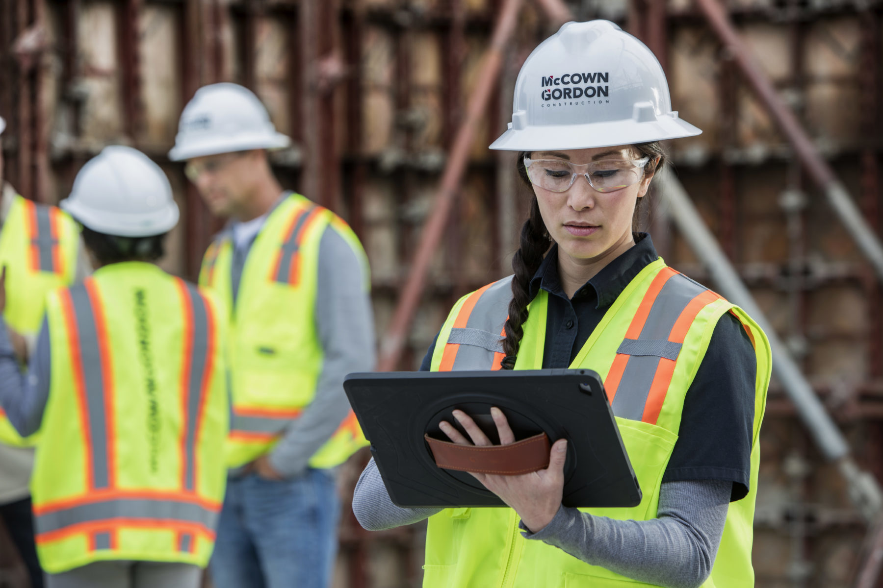 A woman using an iPad on a McCownGordon Construction job site
