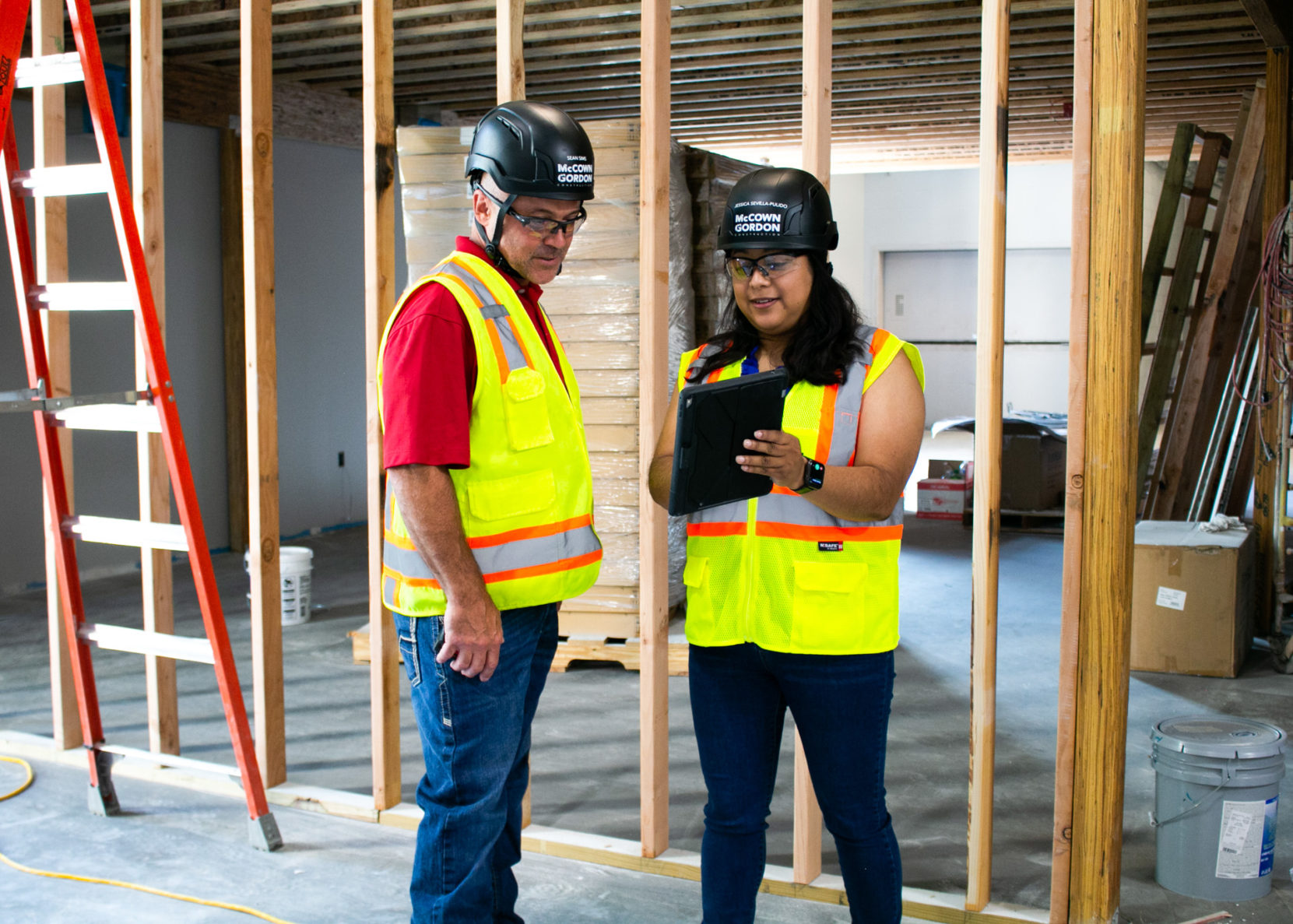 McCownGordon associates looking at an ipad on an active construction job site