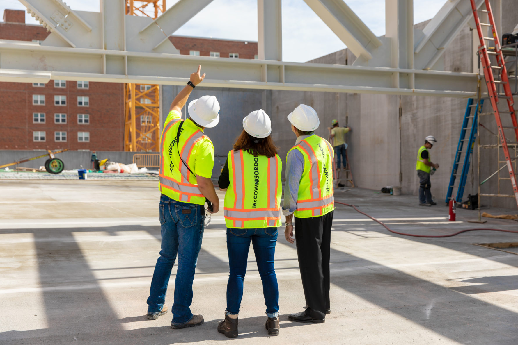 McCownGordon associates taking a client on a tour of a construction job site