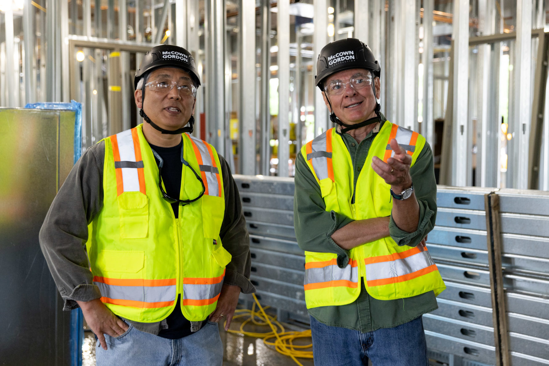 Two McCownGordon Construction associates collaborating on an active job site