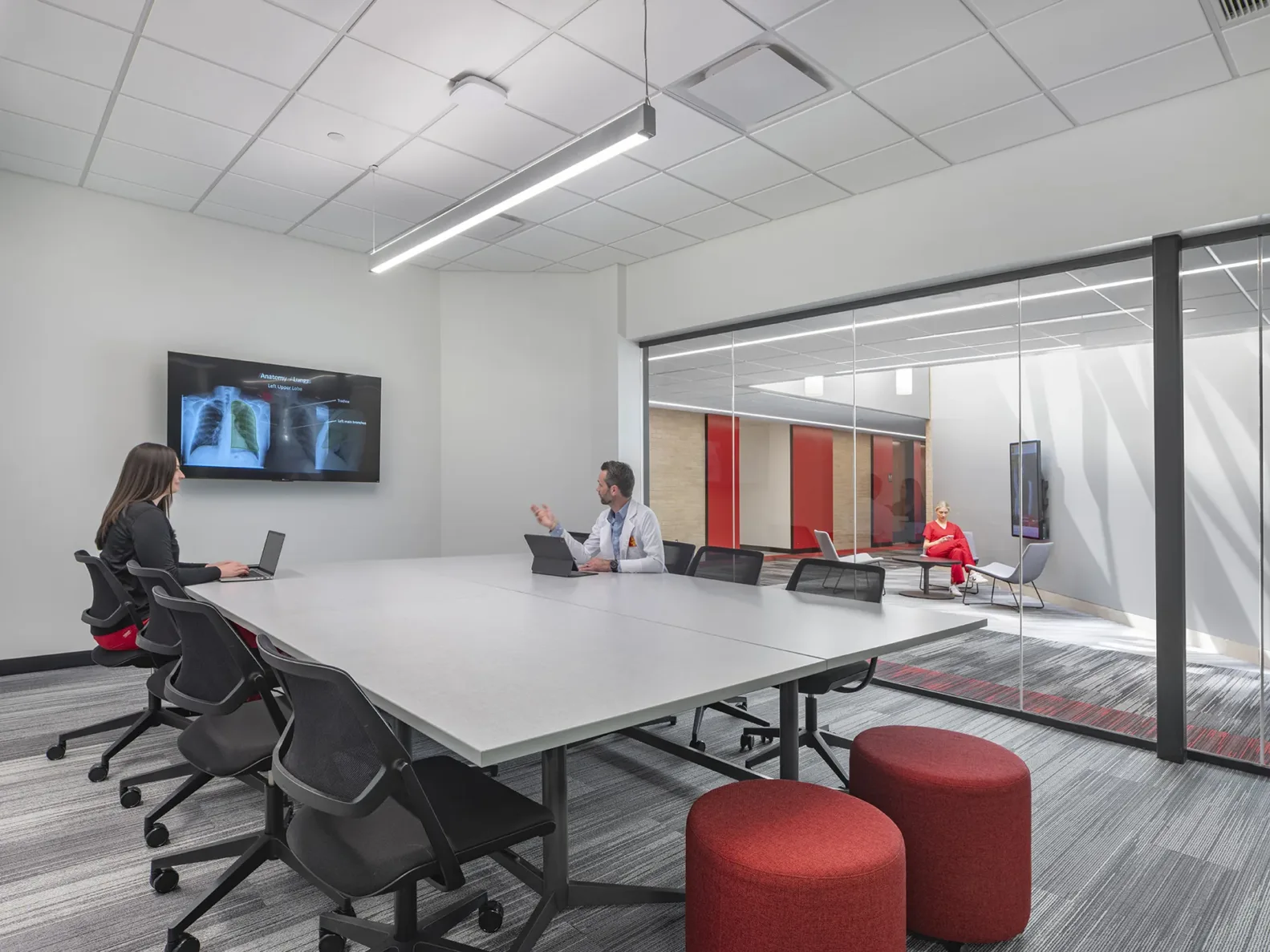 Two nursing students studying in a conference room at Pitt State's nursing school, built by McCownGordon
