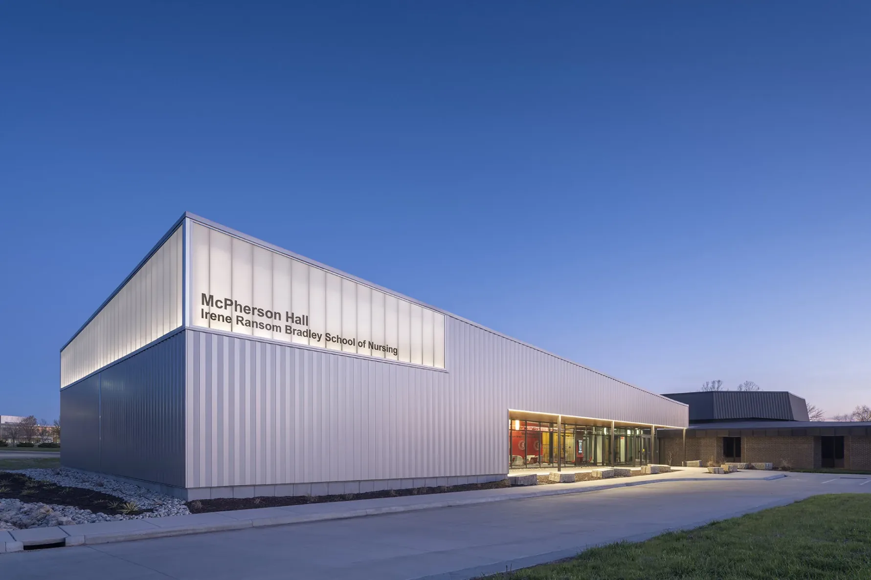 An exterior shot of McPherson Hall at dusk, a nursing school built by McCownGordon Construction