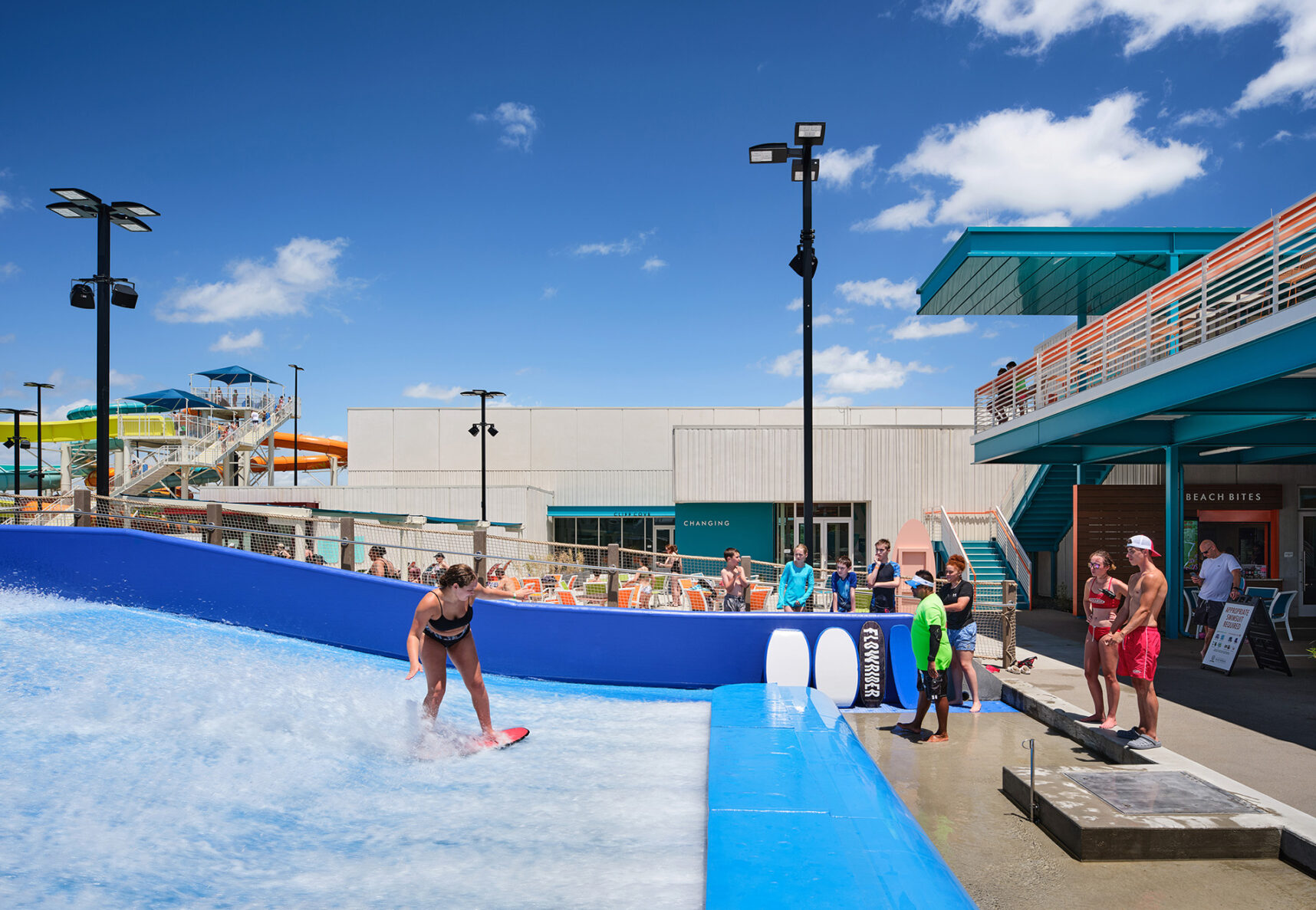 Girl using surf simulator at City of Blue Springs Blue Surf Bay Waterpark