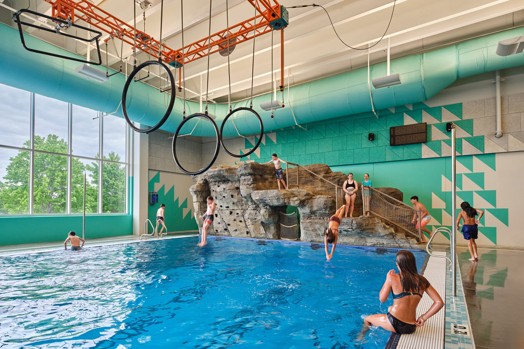 Indoor rock wall and pool at City of Blue Springs Blue Surf Bay Waterpark