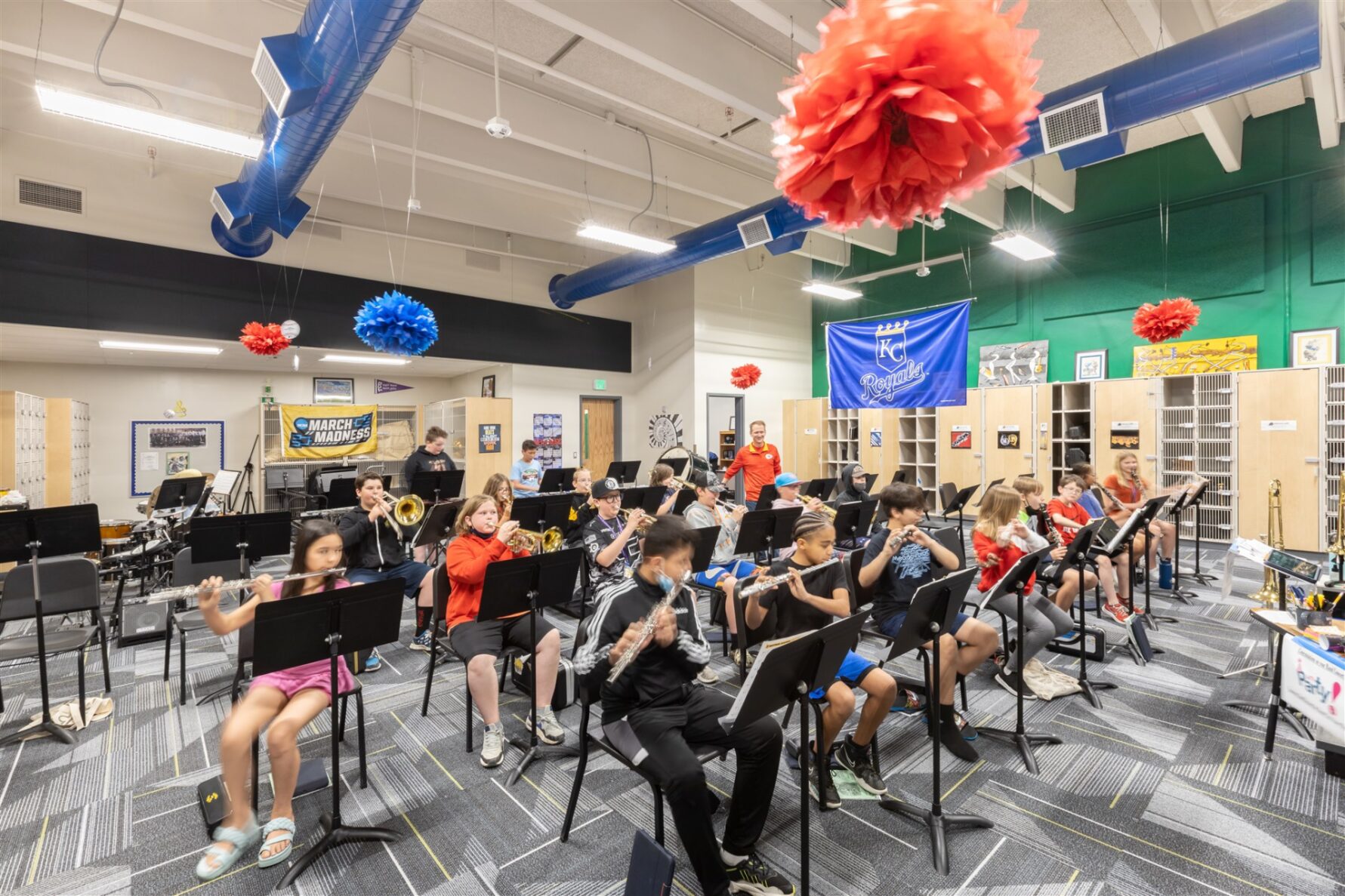 Students playing instruments in the choir room at the NKC Gateway 6th Grade Center, renovated by McCownGordon Construction