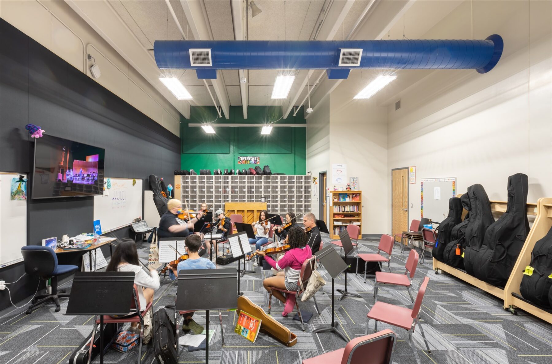 Students playing instruments in the choir room at the NKC Gateway 6th Grade Center, renovated by McCownGordon Construction