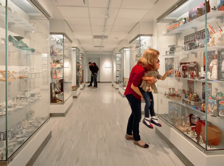 people looking at the miniature toys