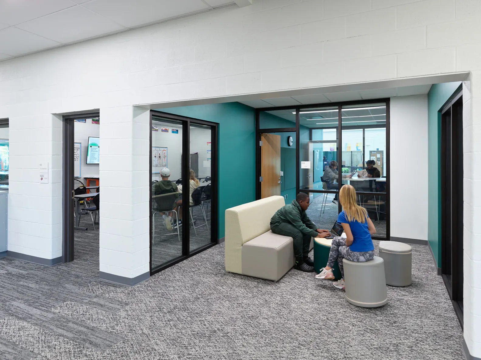 Students collaborating in a seating area outside of a classroom at Platte Purchase Middle School