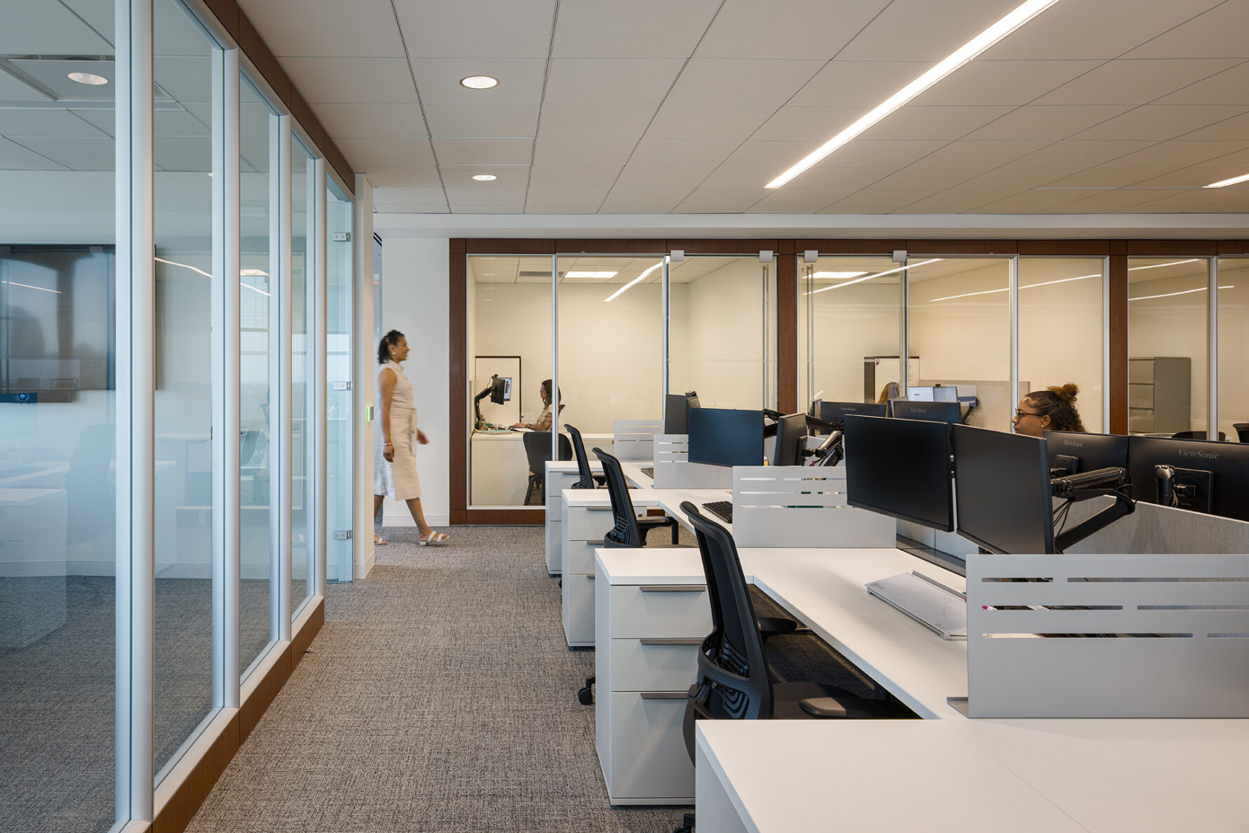 Cubicles with monitors in an office