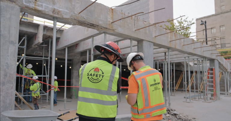 a McCownGordon Construction associate talking to a trade partner on a jobsite