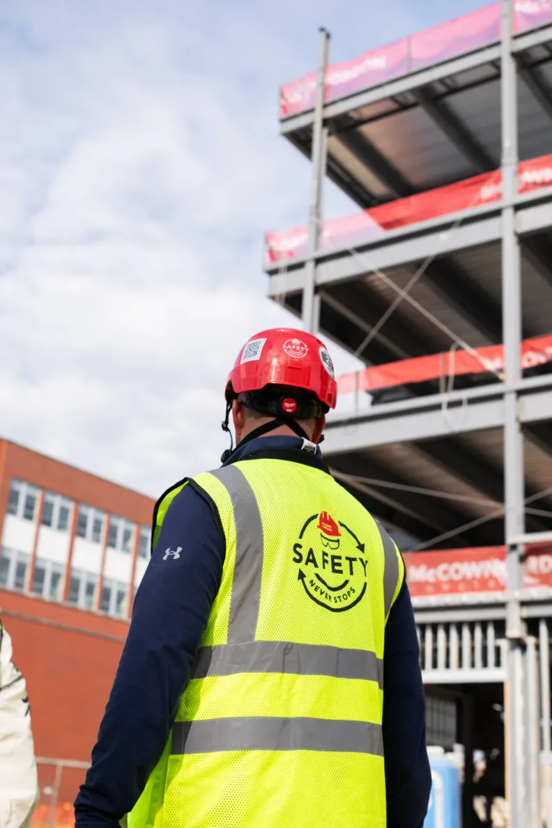 McCownGordon Construction associate looking at progress on site