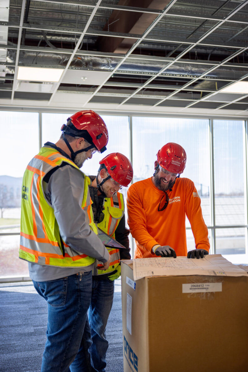 McCownGordon associates talking on jobsite.