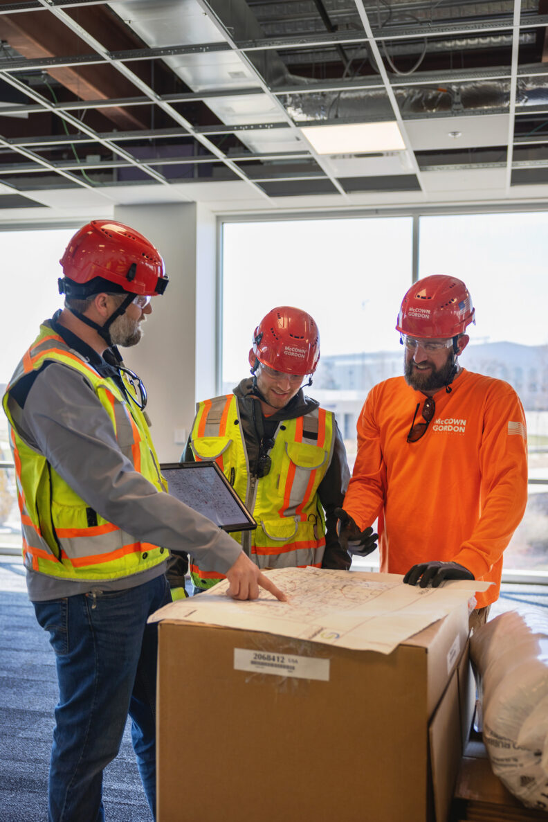 McCownGordon associates talking on jobsite.