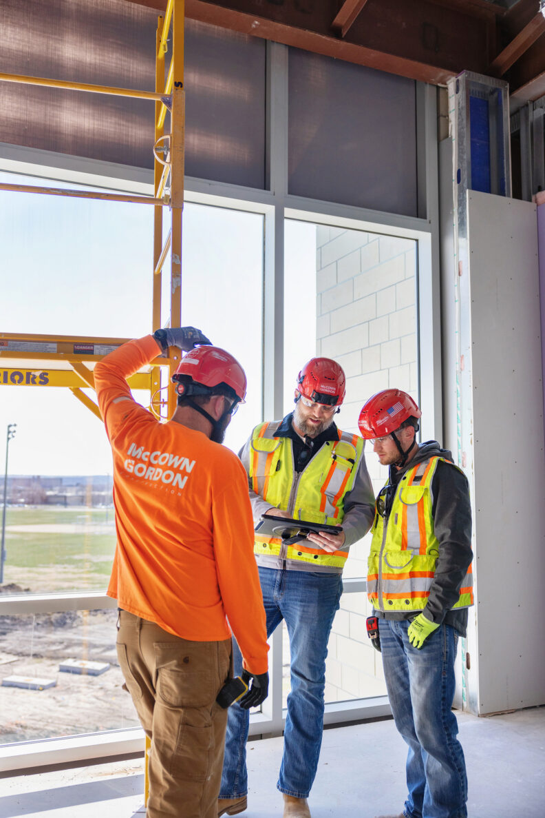 McCownGordon associates talking on jobsite.