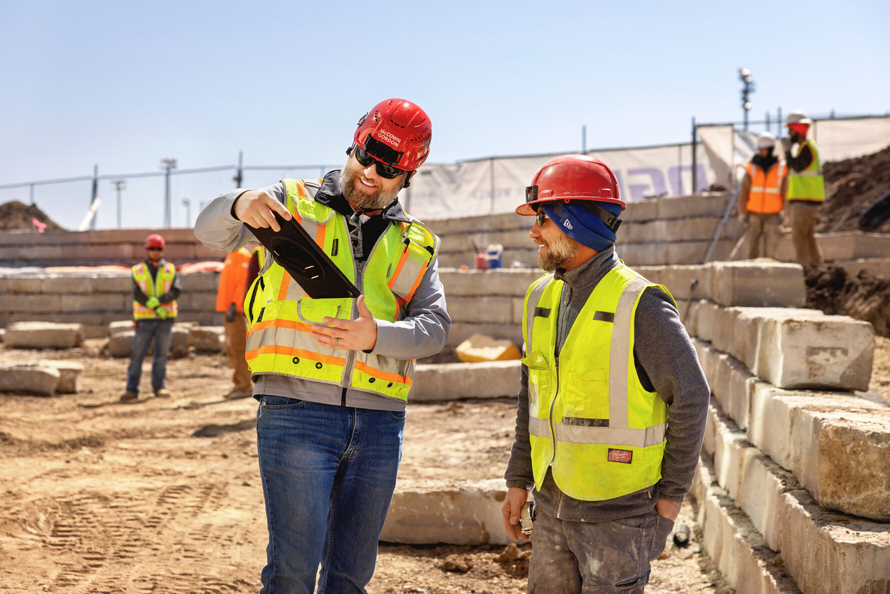 McCownGordon associates talking on jobsite.