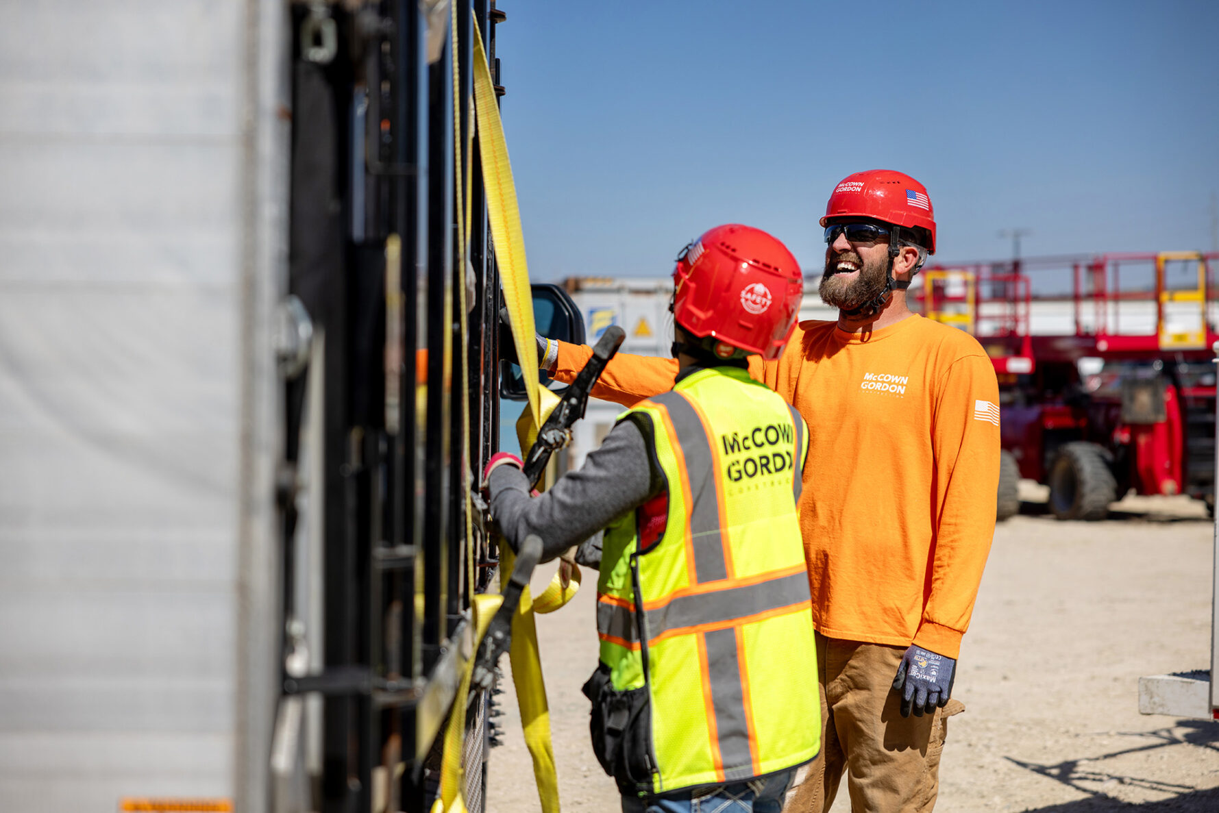 McCownGordon associates talking on jobsite.
