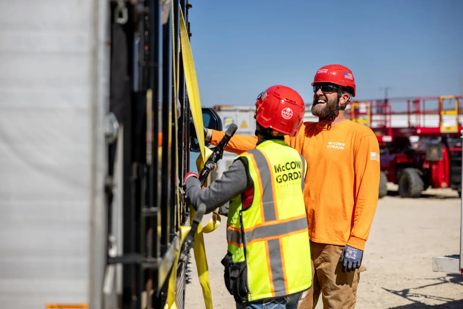 McCownGordon associates talking on jobsite.