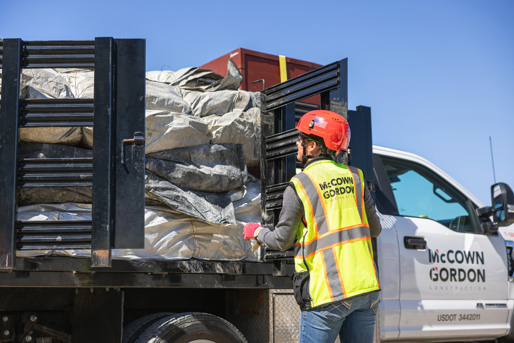 McCownGordon associate unloading truck on jobsite.