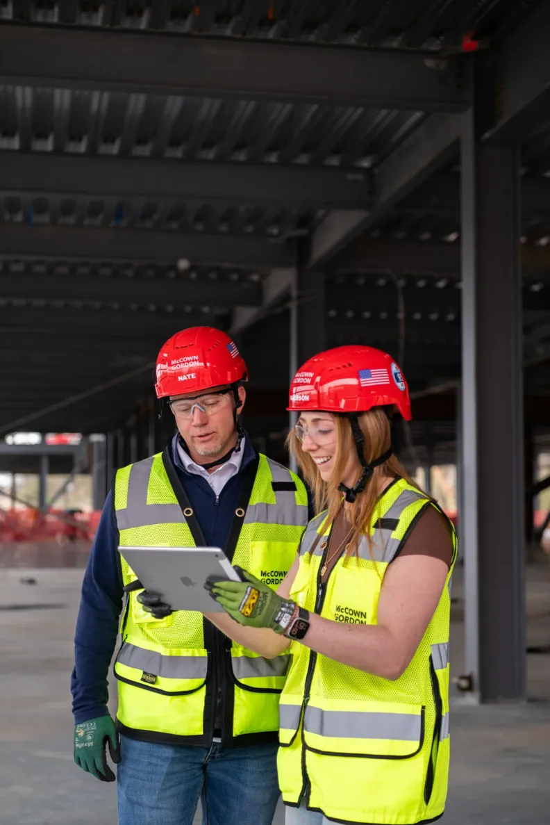 McCownGordon associates talking on jobsite.