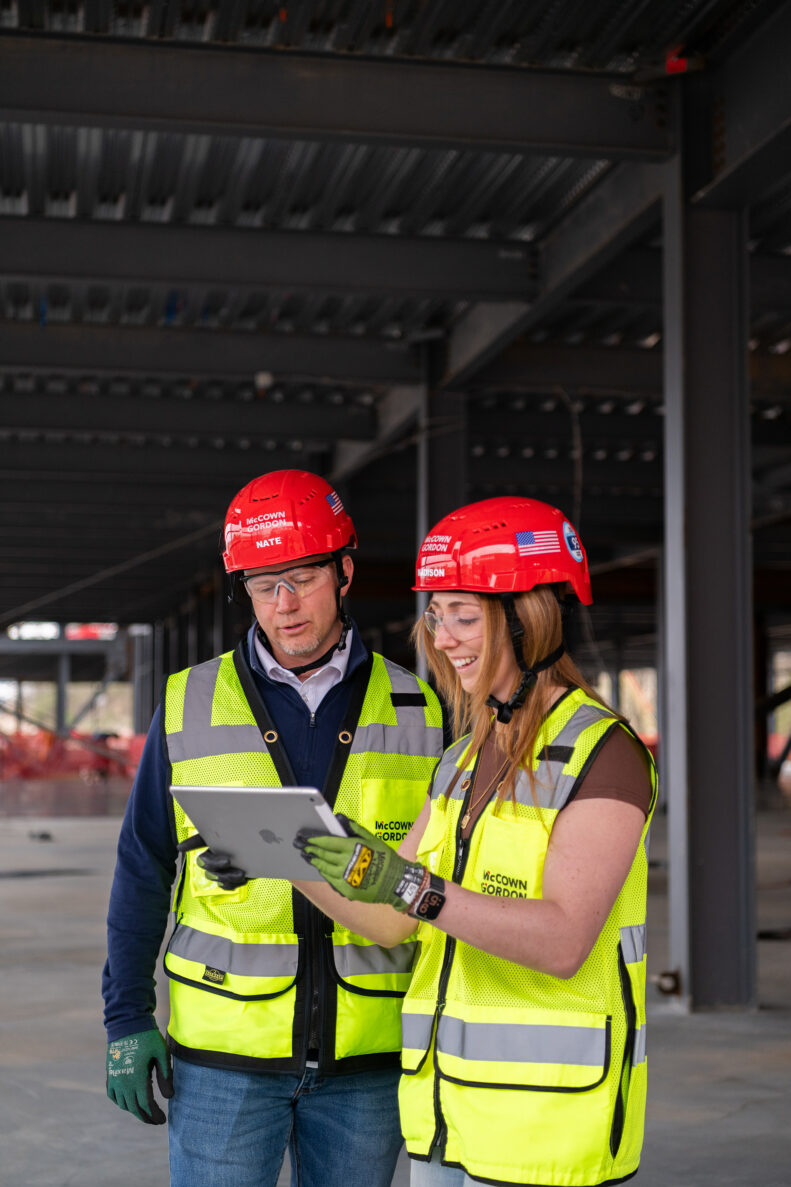 McCownGordon associates talking on jobsite.