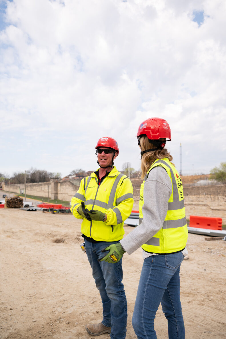 McCownGordon associates talking on jobsite.