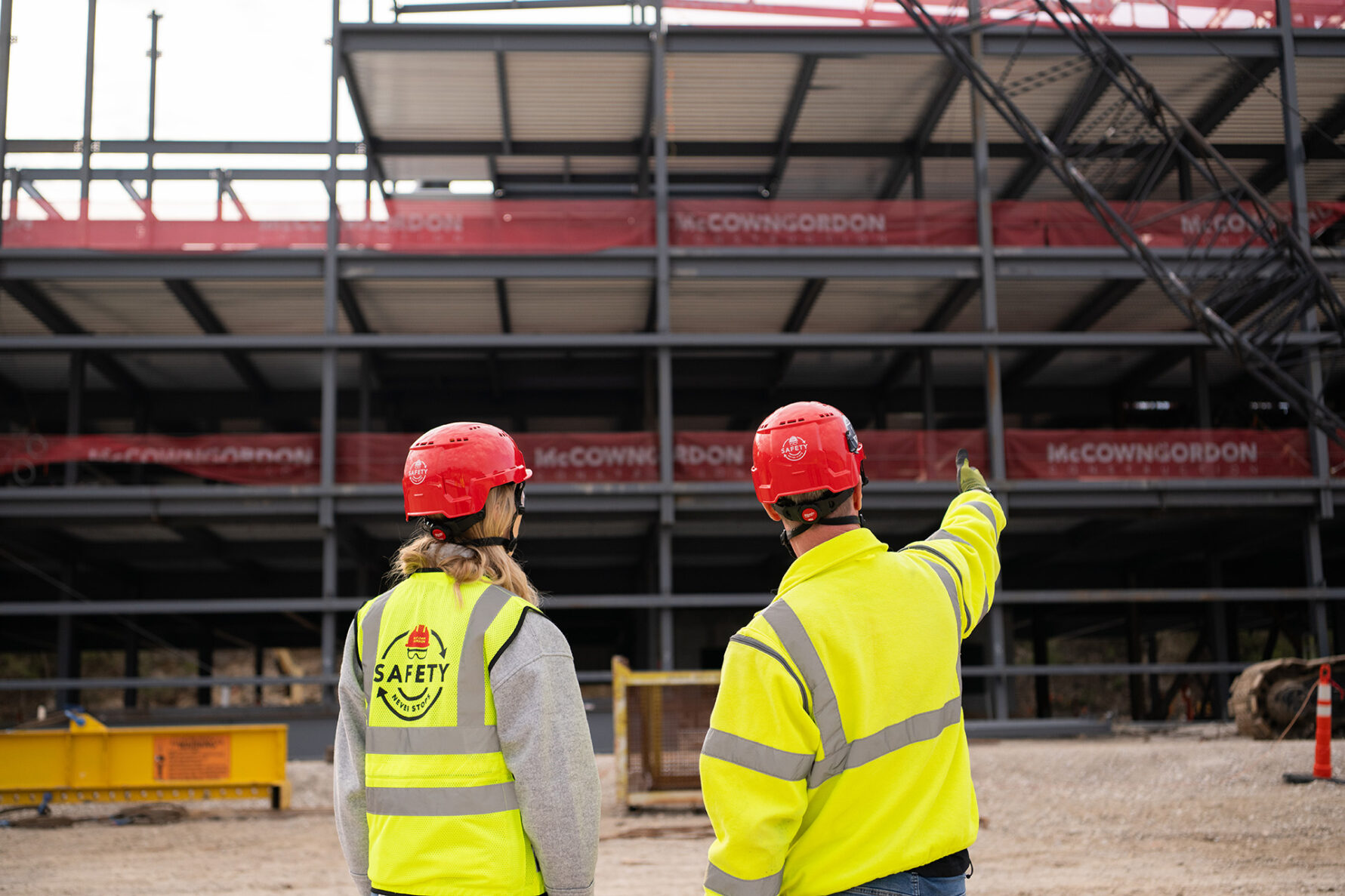 McCownGordon associates talking on jobsite.