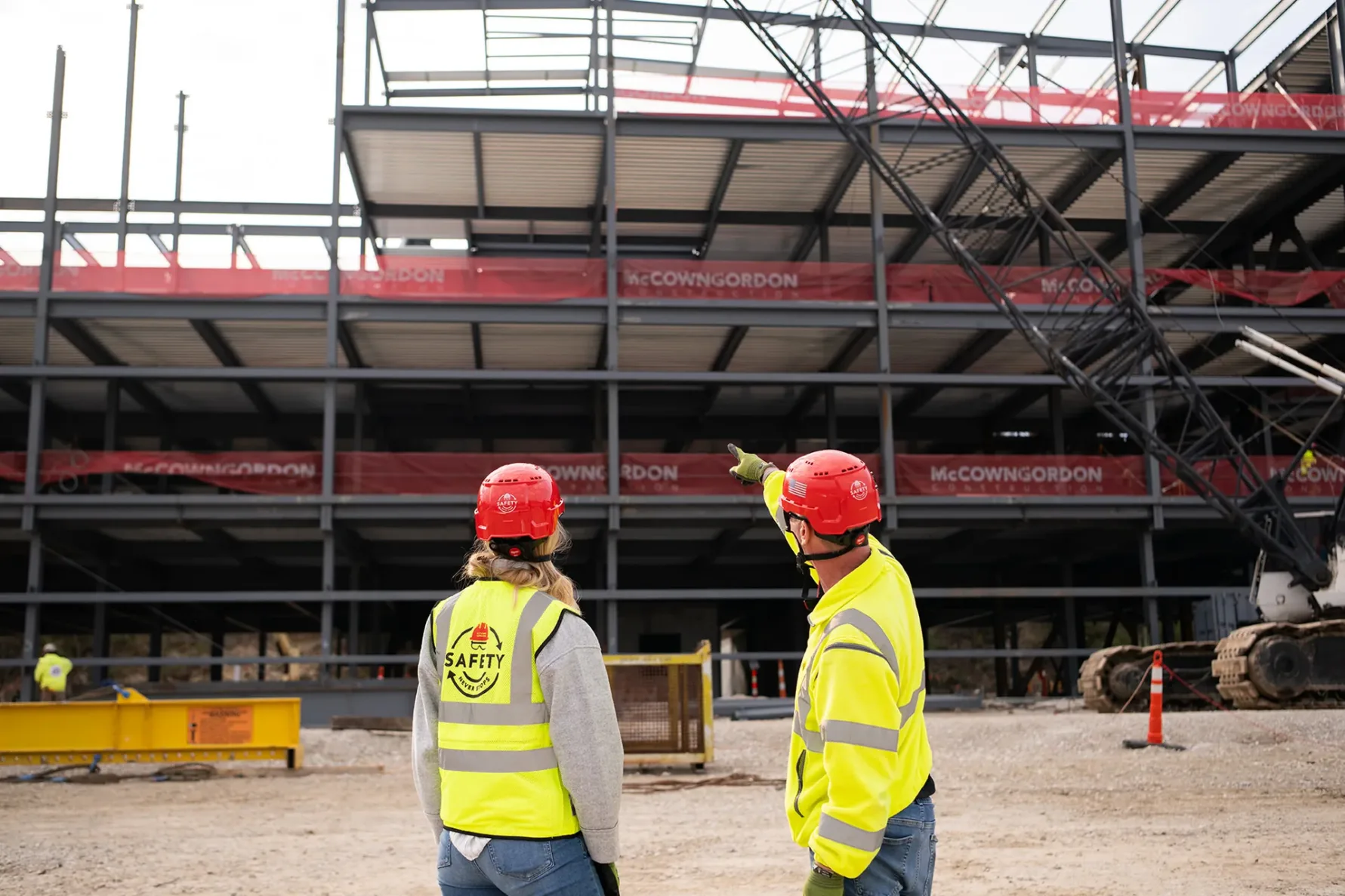 McCownGordon associates talking on jobsite.
