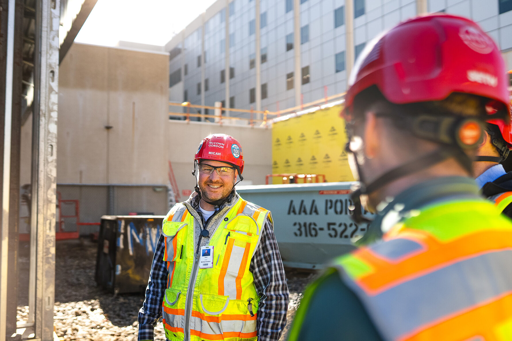 McCownGordon associates talking on jobsite.