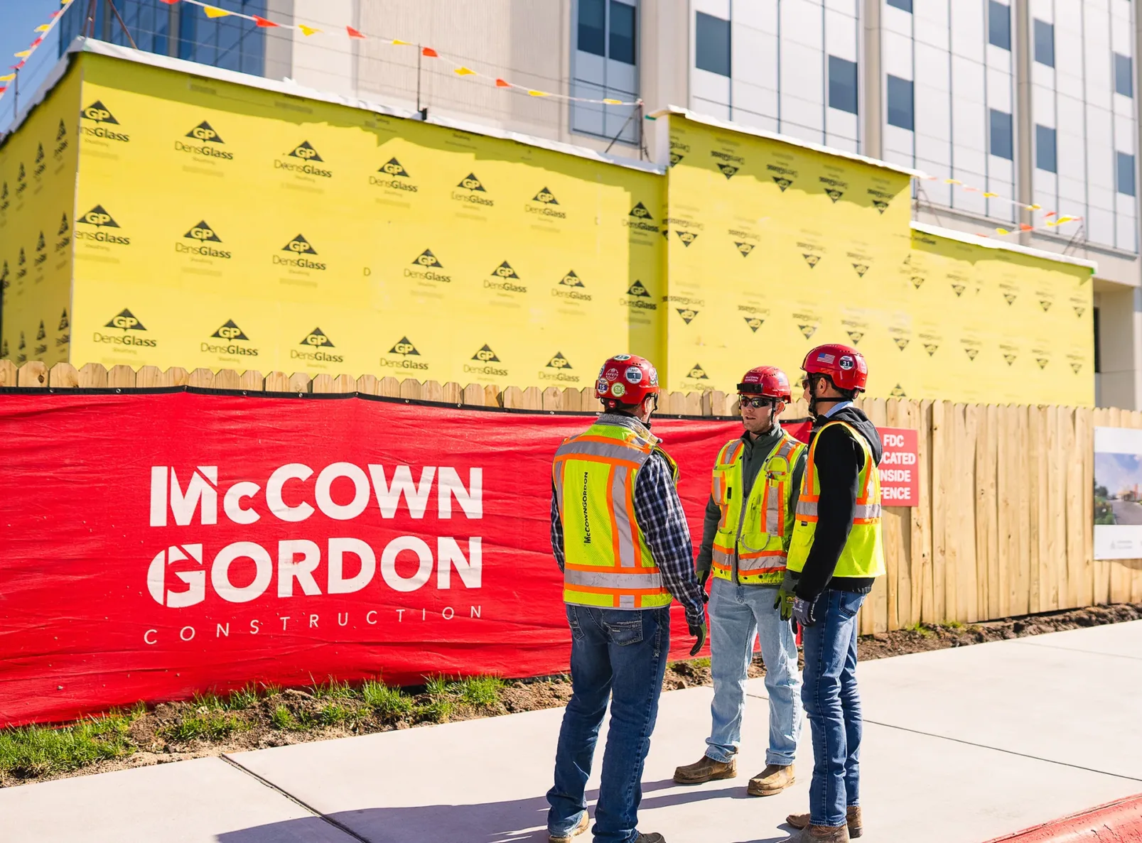 McCownGordon associates talking on jobsite.