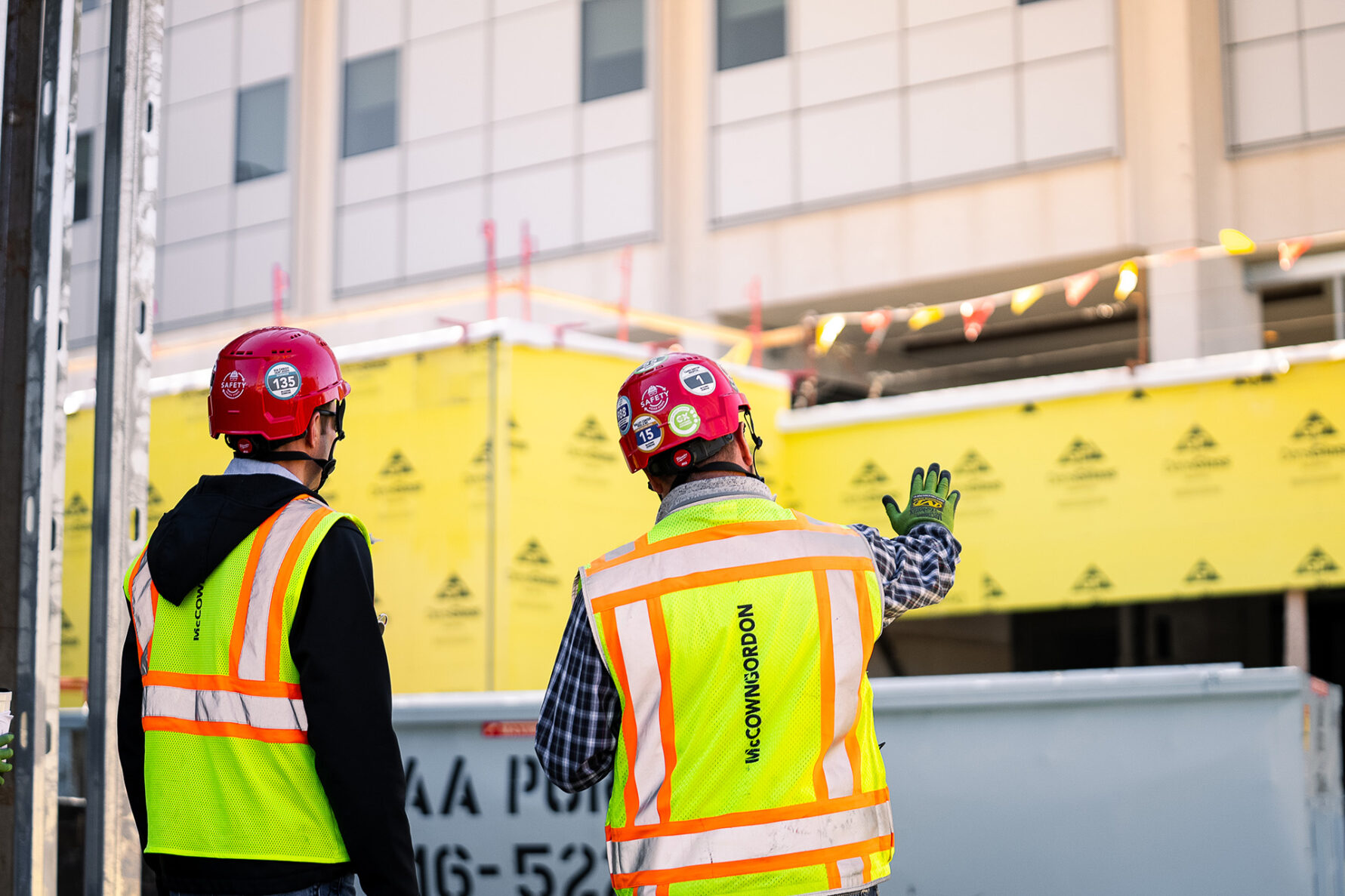 McCownGordon associates talking on jobsite.