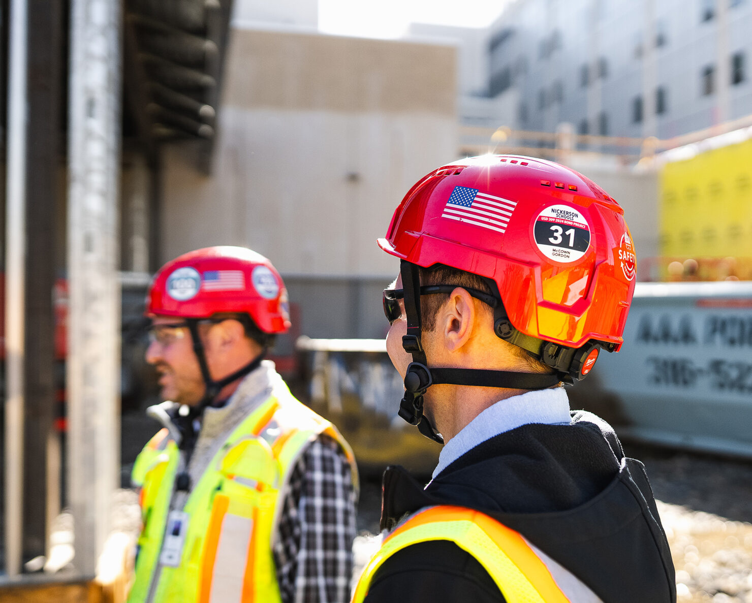 McCownGordon associates talking on jobsite.