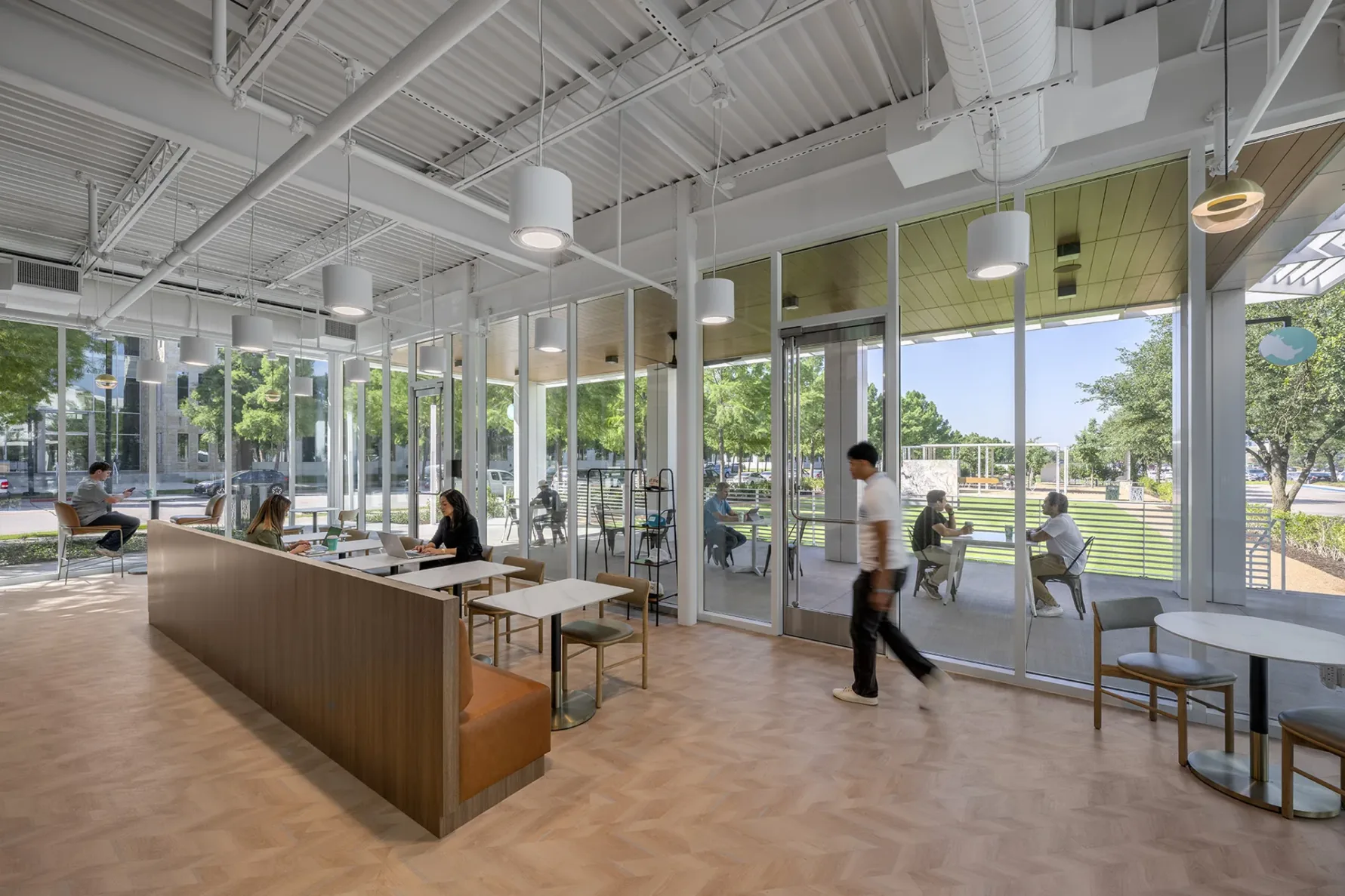 Severak people working in collaboration space at White Rhino Coffee and Conference Center in Dallas Texas