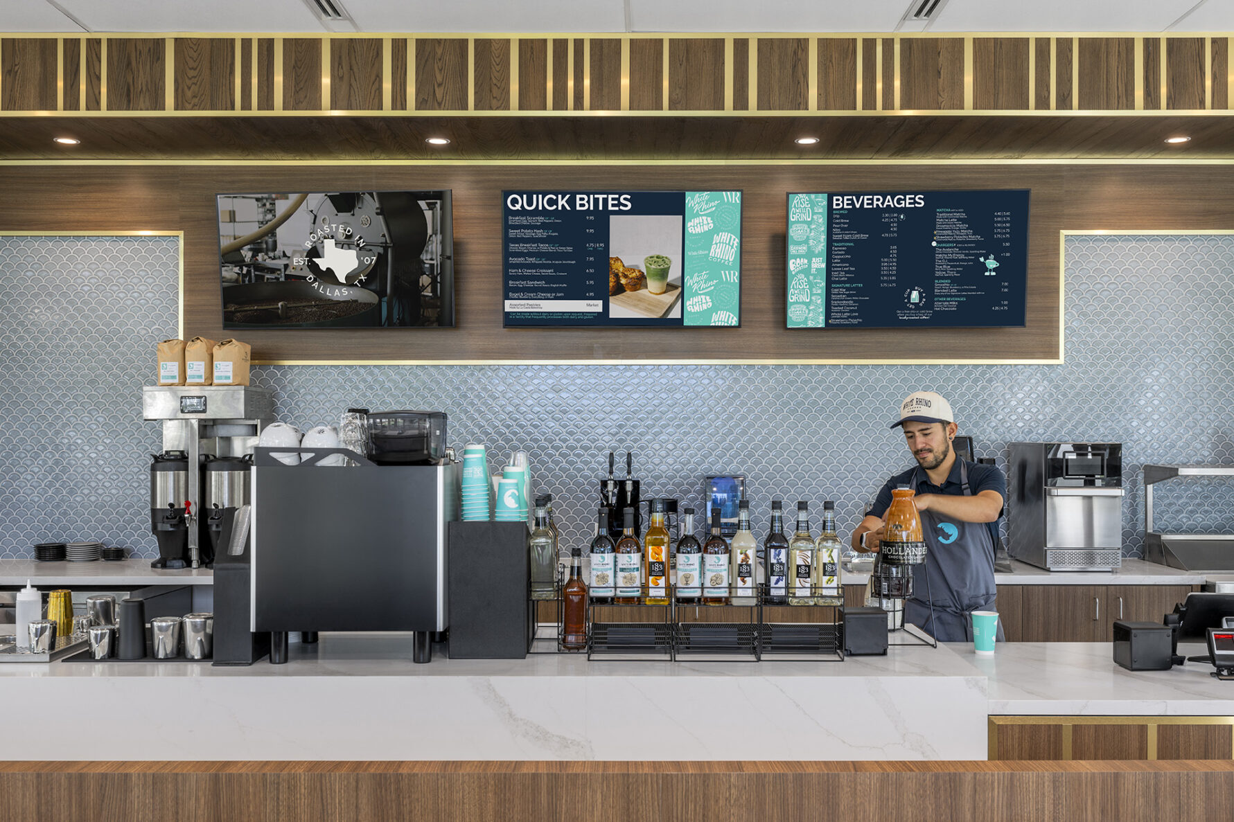 Barista making coffee behind the bar