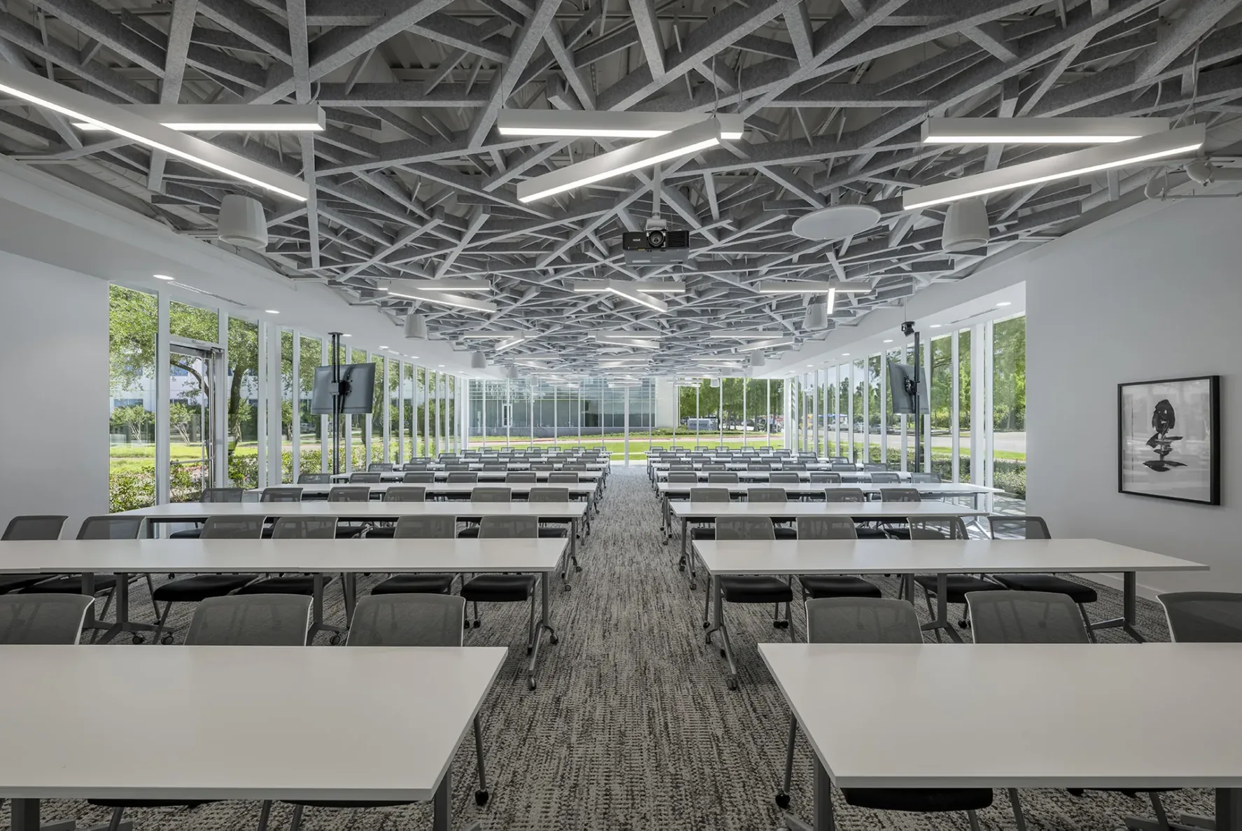 Empty conference space filled with tables at White Rhino Coffee and Conference Center in Dallas Texas
