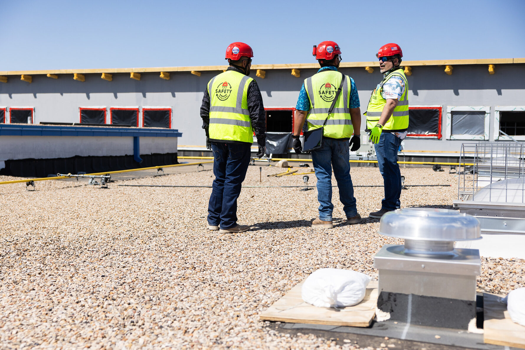 McCownGordon associates talking on jobsite.