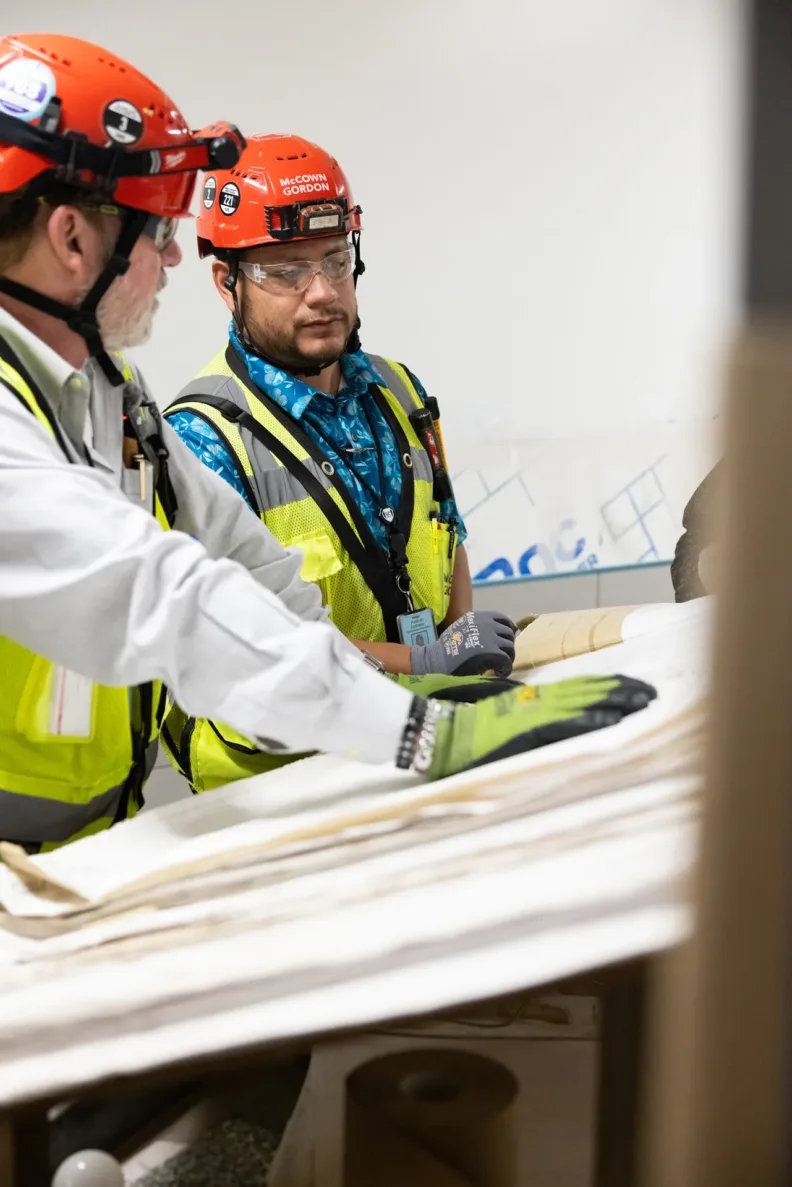 McCownGordon associates talking on jobsite.