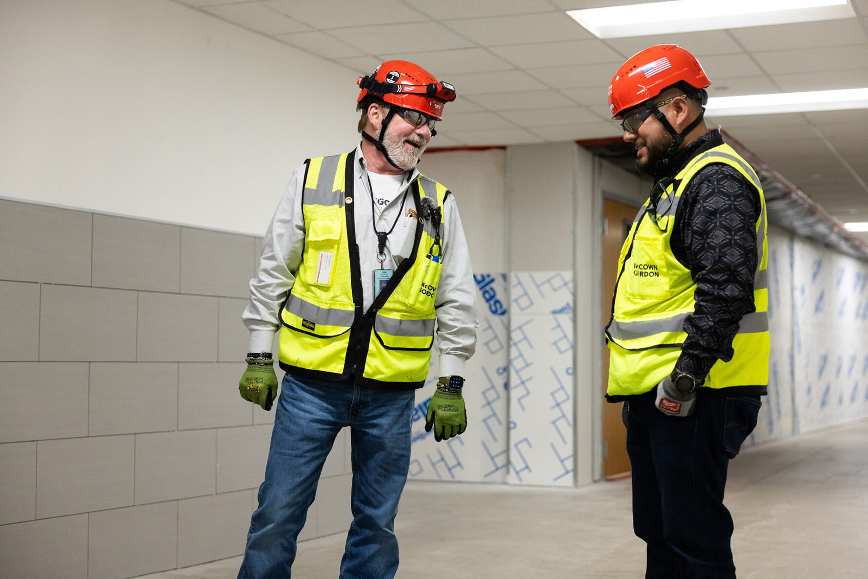 McCownGordon associates talking on jobsite.