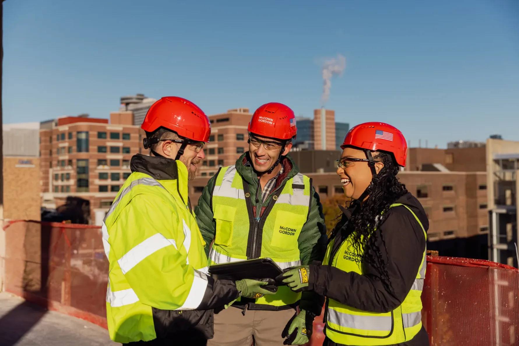 McCownGordon associates talking and laughing on a jobsite